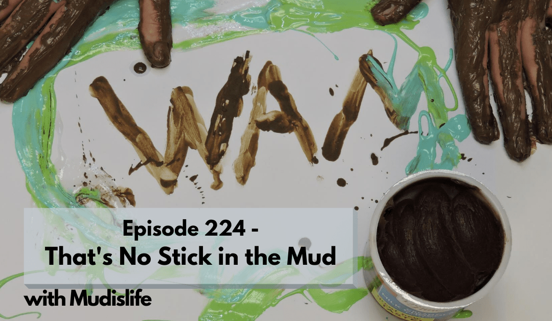 WAM written out in mud, surrounded by smeared finger paint and muddy hands. Episode 224 - That's No Stick in the Mud, with Mudislife